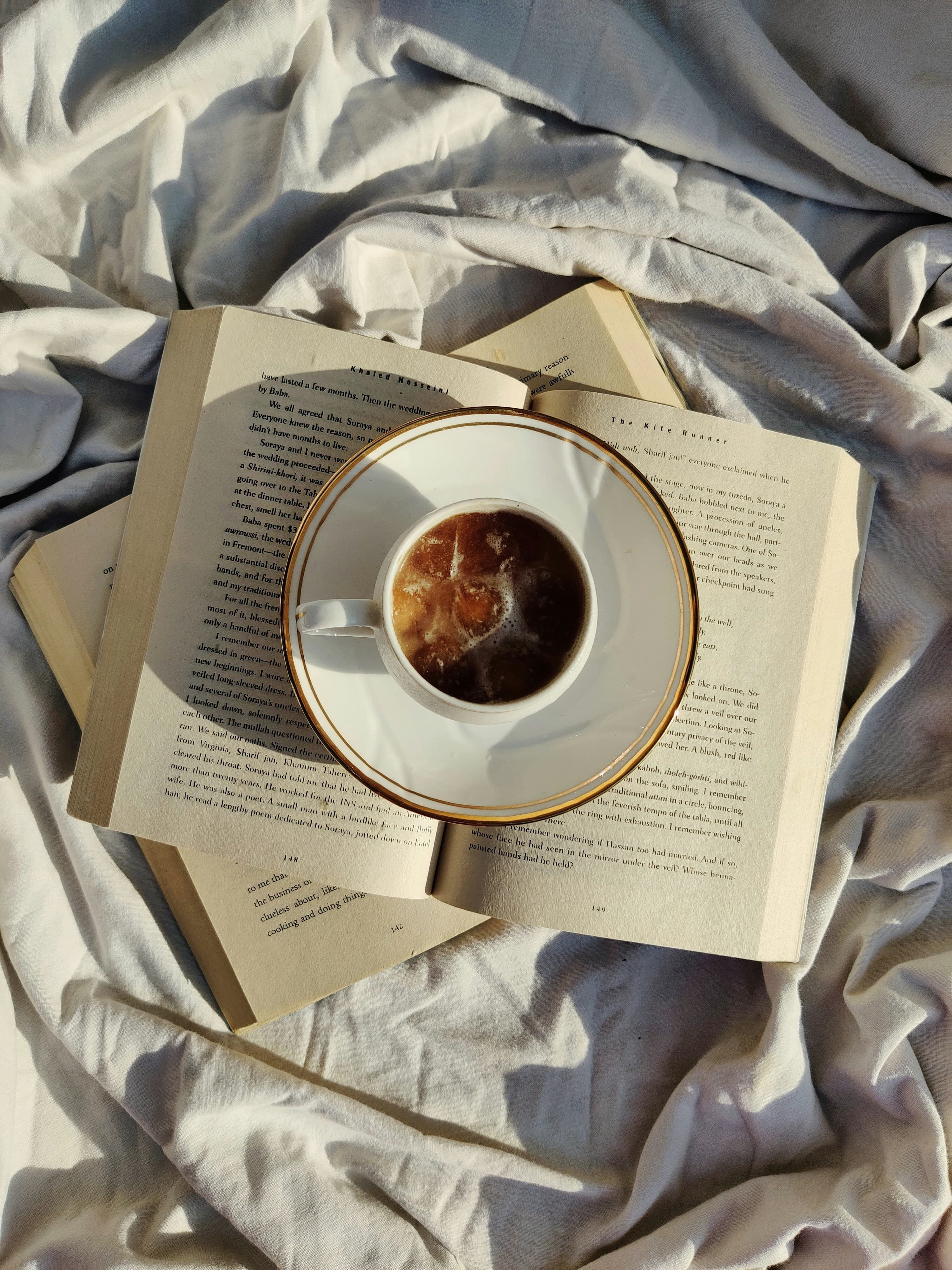 A book and coffee in a reading nook